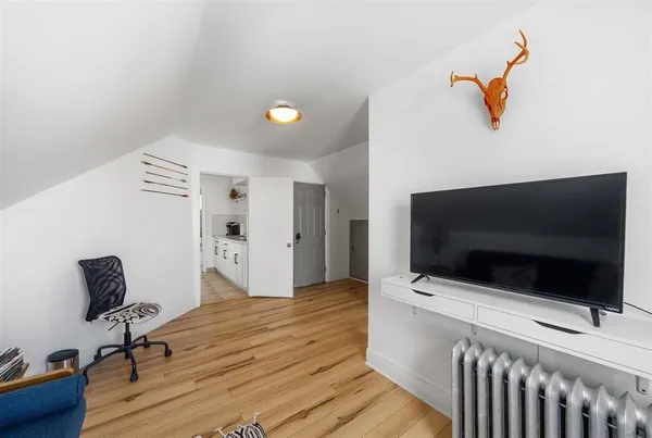 a view of a livingroom with a flat screen tv