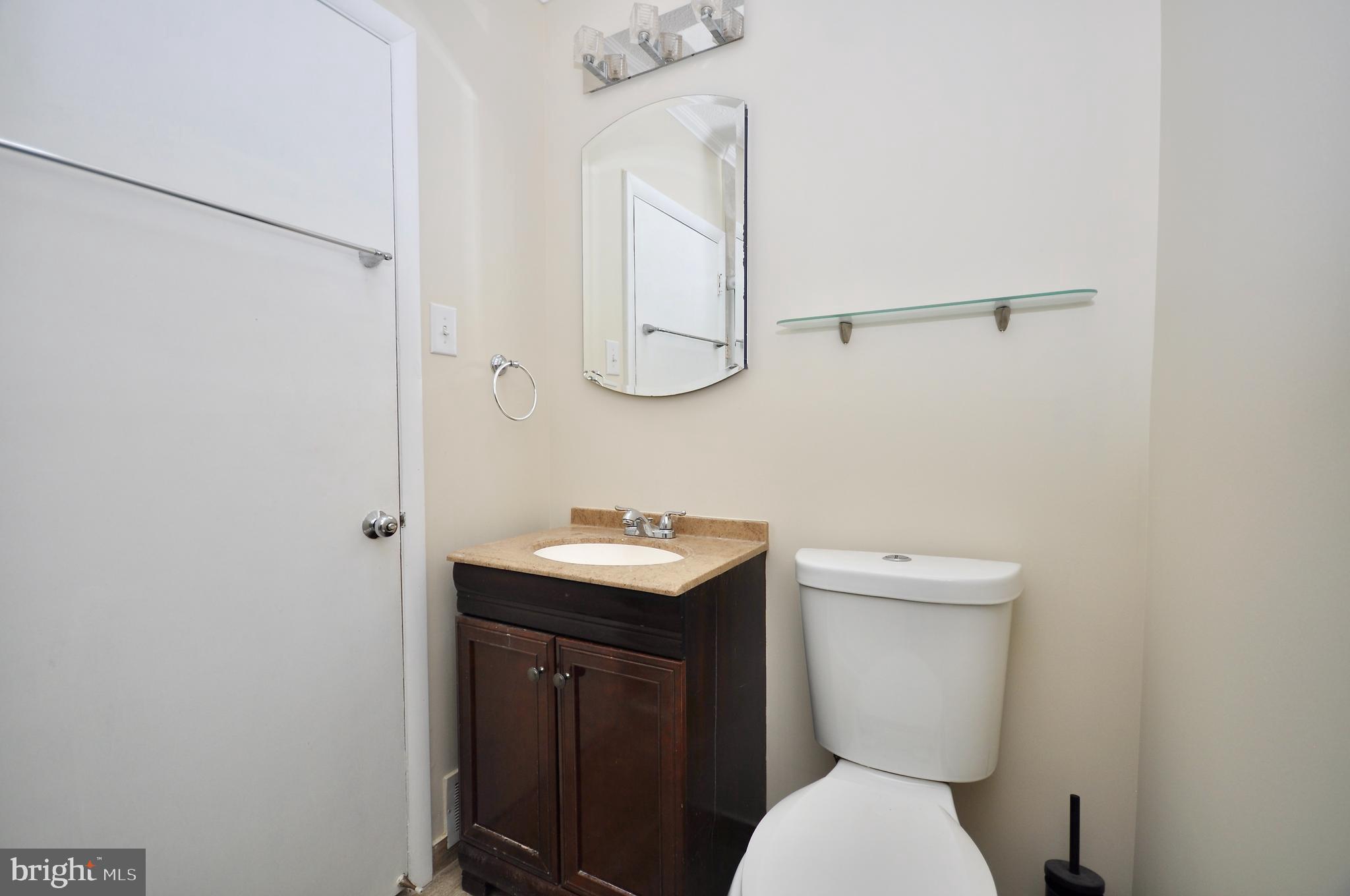 2216 Emerson Street Philadelphia, PA 19152 - Photo 12 of 31 a bathroom with a toilet sink and mirror
