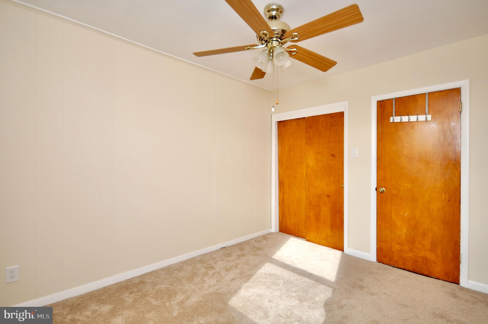 2216 Emerson Street Philadelphia, PA 19152 - Photo 13 of 31 an empty room with a ceiling fan and a window