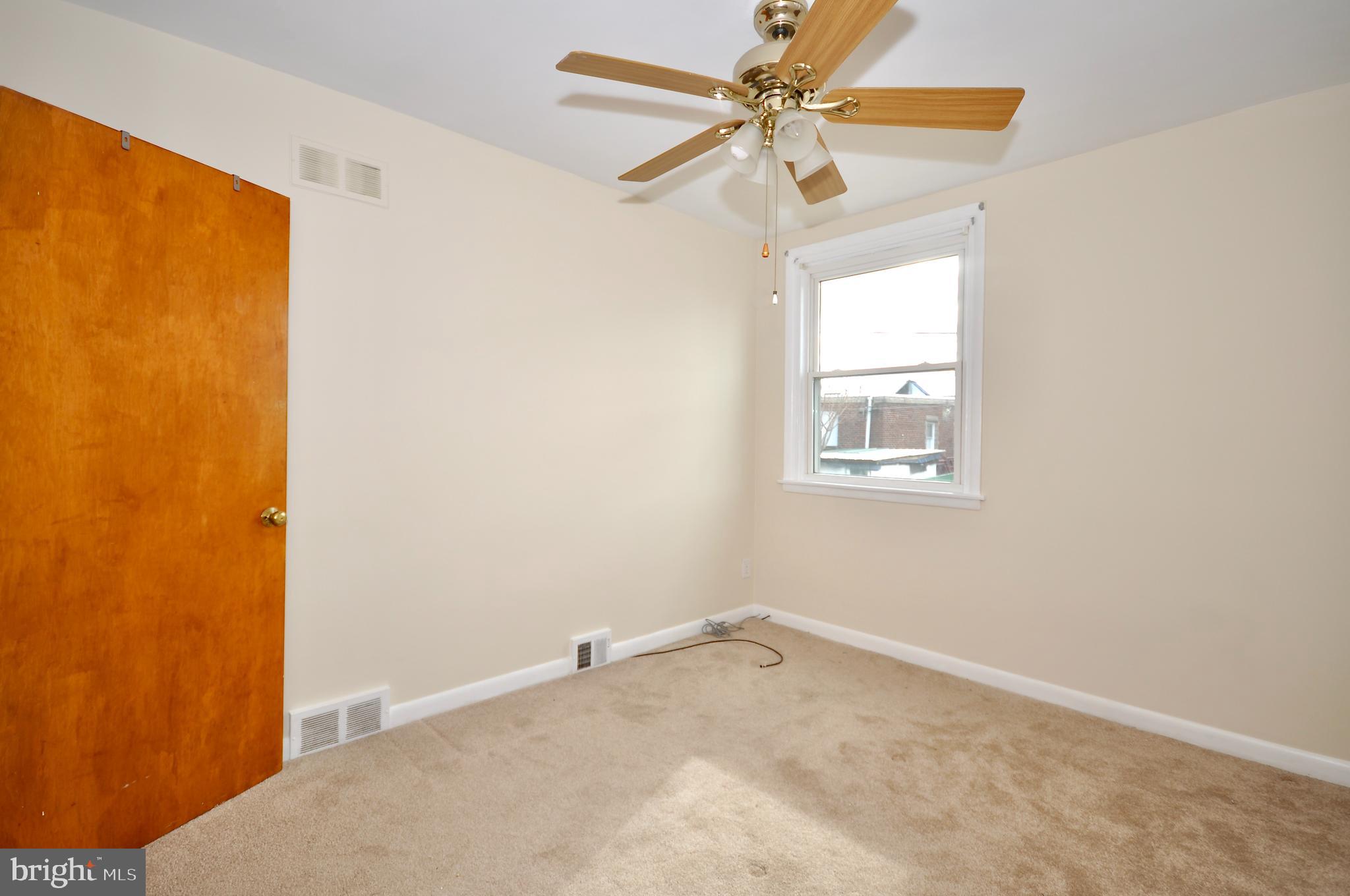 2216 Emerson Street Philadelphia, PA 19152 - Photo 15 of 31 an empty room with a window and a fan
