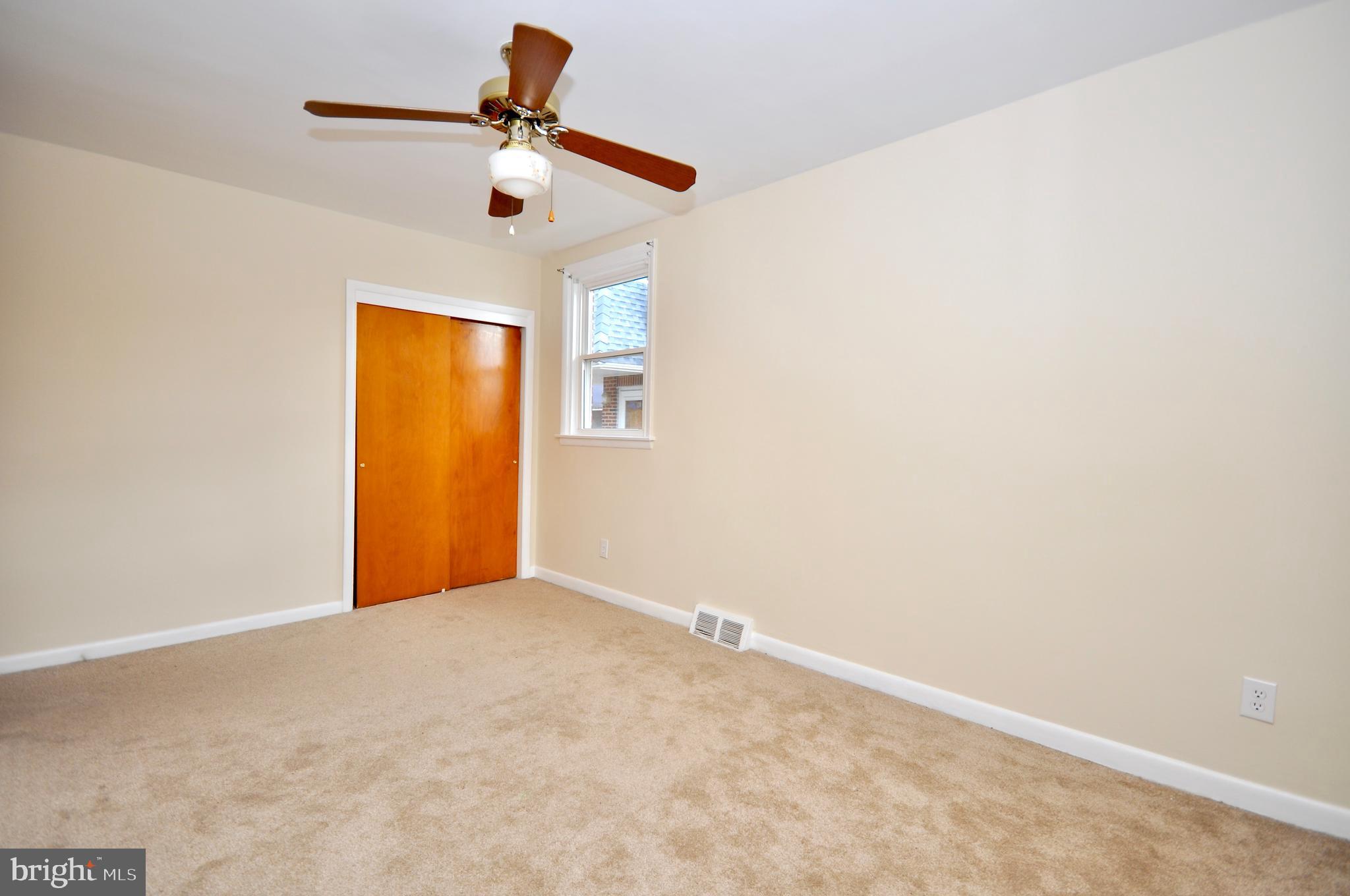 2216 Emerson Street Philadelphia, PA 19152 - Photo 18 of 31 an empty room with a window and a ceiling fan