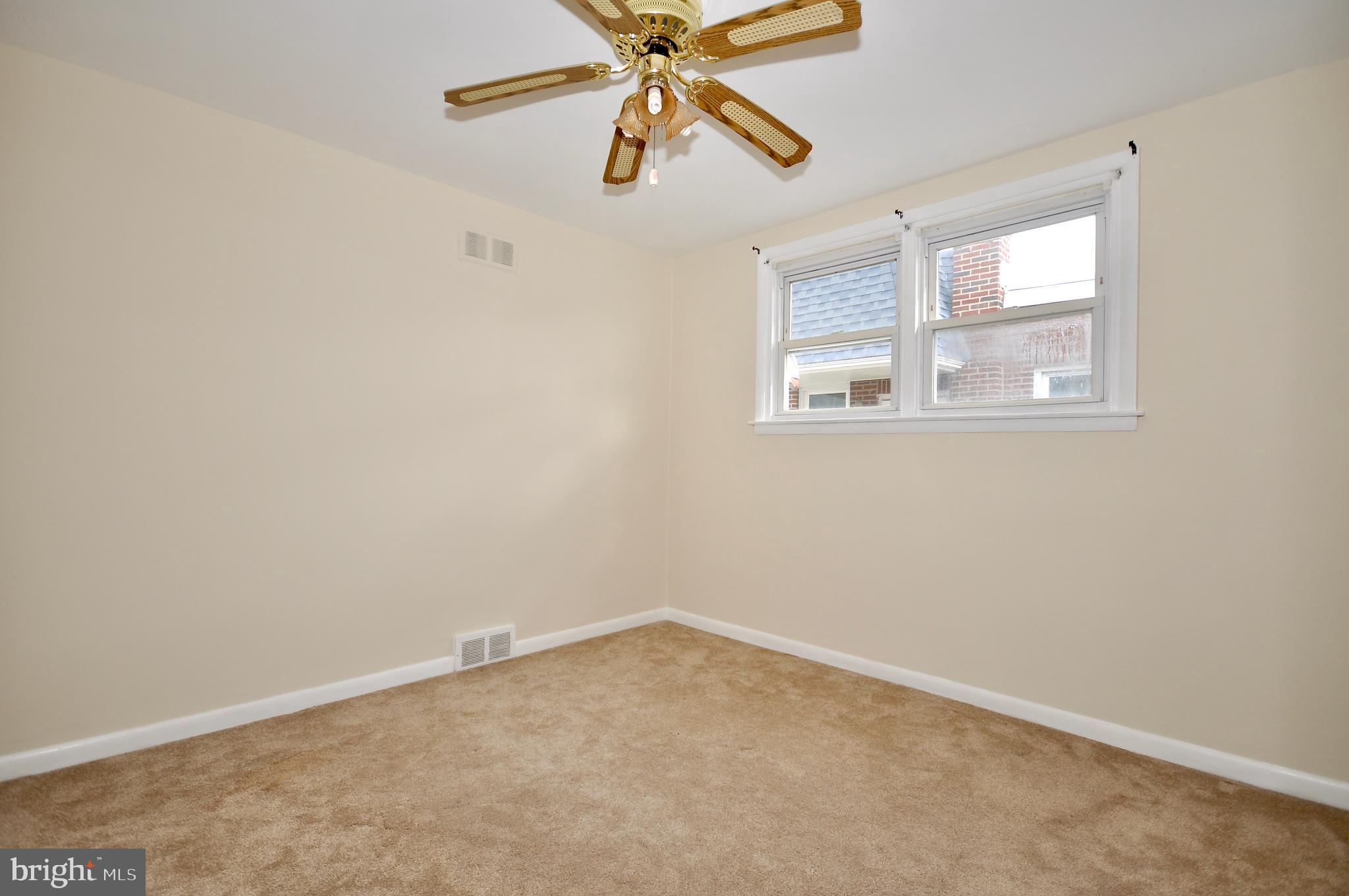 2216 Emerson Street Philadelphia, PA 19152 - Photo 23 of 31 an empty room with windows and fan