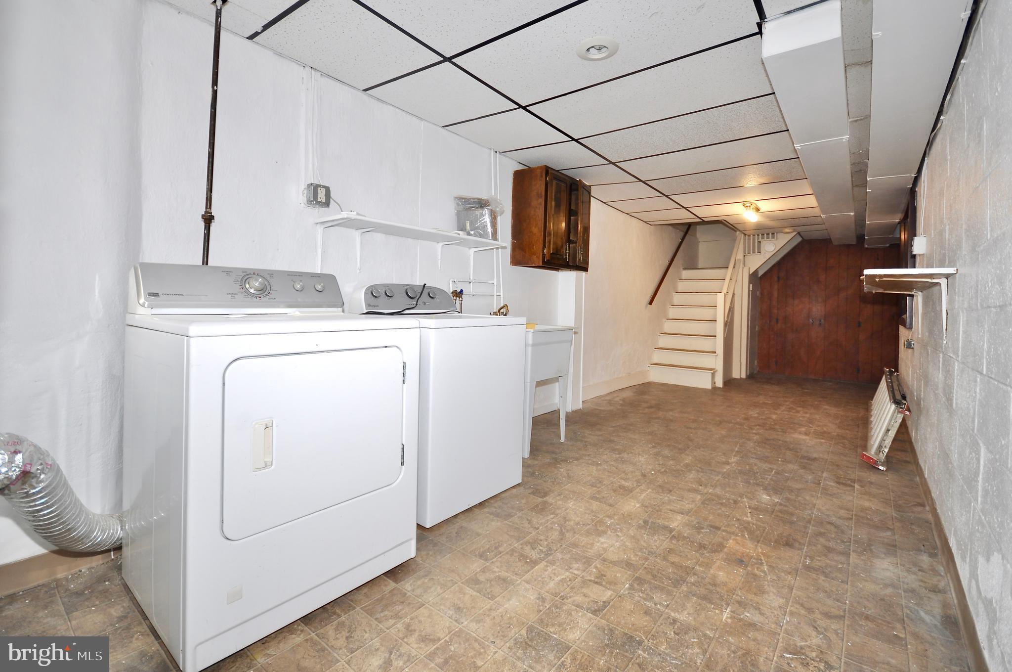 2216 Emerson Street Philadelphia, PA 19152 - Photo 25 of 31 a view of storage and utility room with washer and dryer
