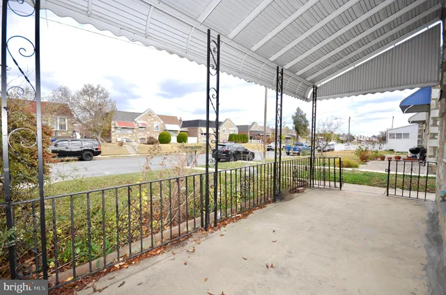 a view of a park with a car park from a balcony