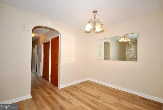 a view of a livingroom with wooden floor