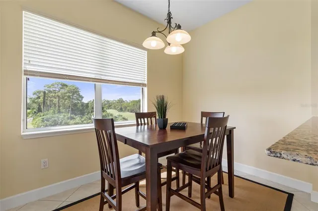 a bedroom with a large bed and flat tv screen on dresser