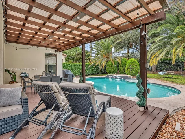 a view of a patio with swimming pool