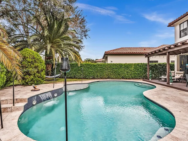 a view of a swimming pool with a patio