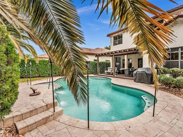 a view of a swimming pool with a patio