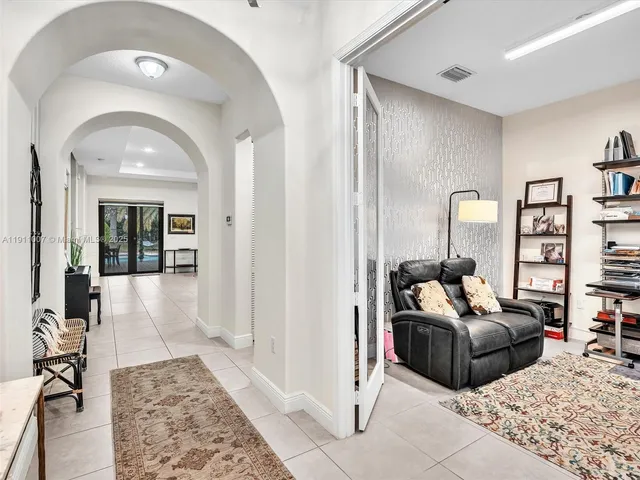 a living room with furniture and a rug