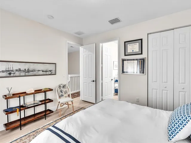a bedroom with furniture and window