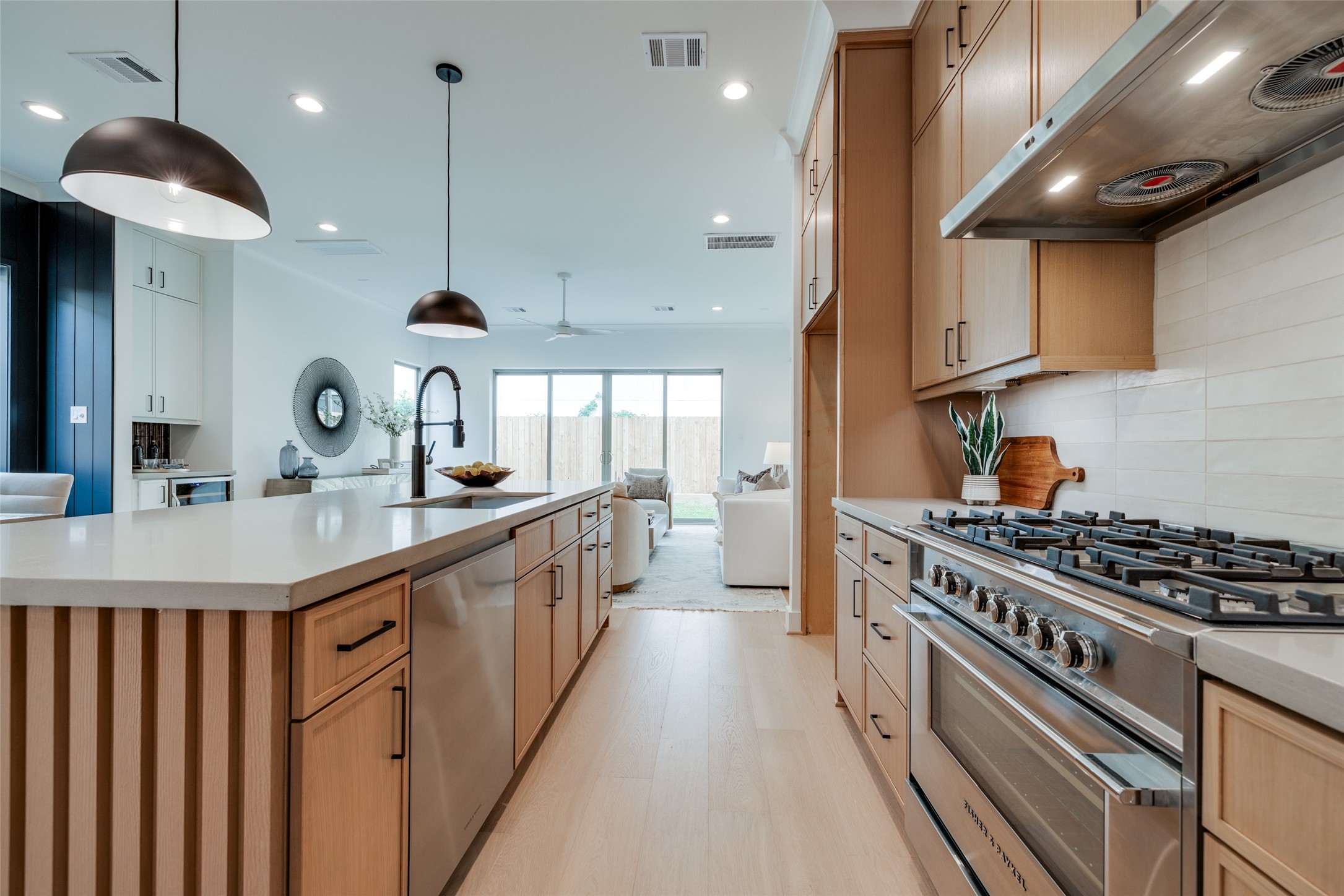 2327 Richton Street Houston, TX 77098 - Photo 16 of 47 a kitchen with stainless steel appliances a sink a stove top oven a counter space a sink and a refrigerator