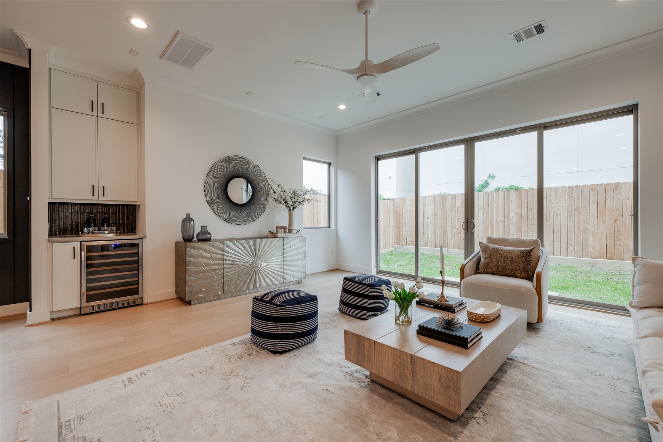 2327 Richton Street Houston, TX 77098 - Photo 23 of 47 a living room with furniture a flat screen tv and a large window