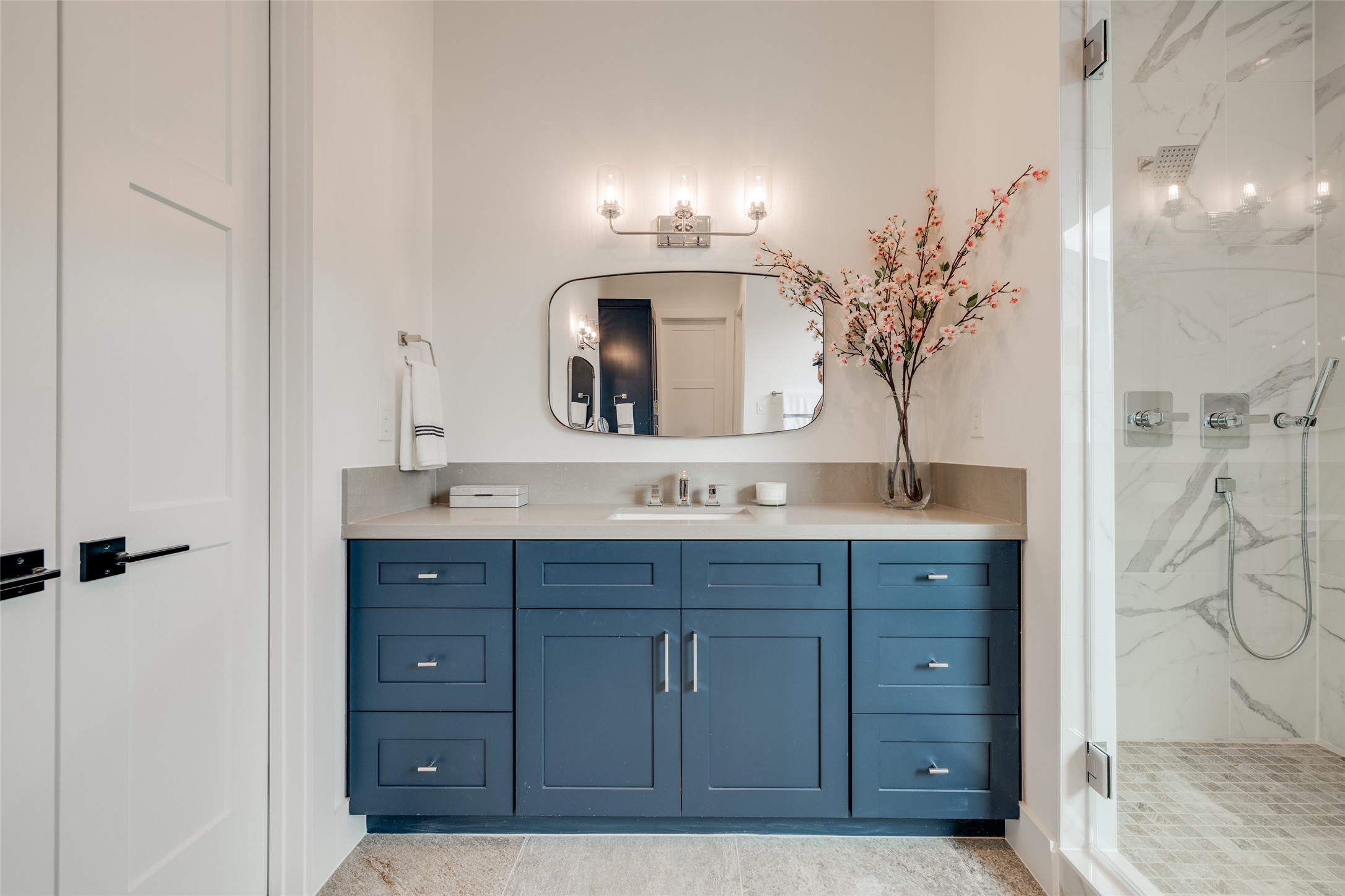 2327 Richton Street Houston, TX 77098 - Photo 32 of 47 a bathroom with a sink and a mirror