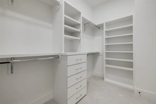 a bathroom with a sink a toilet a mirror a vanity and shower