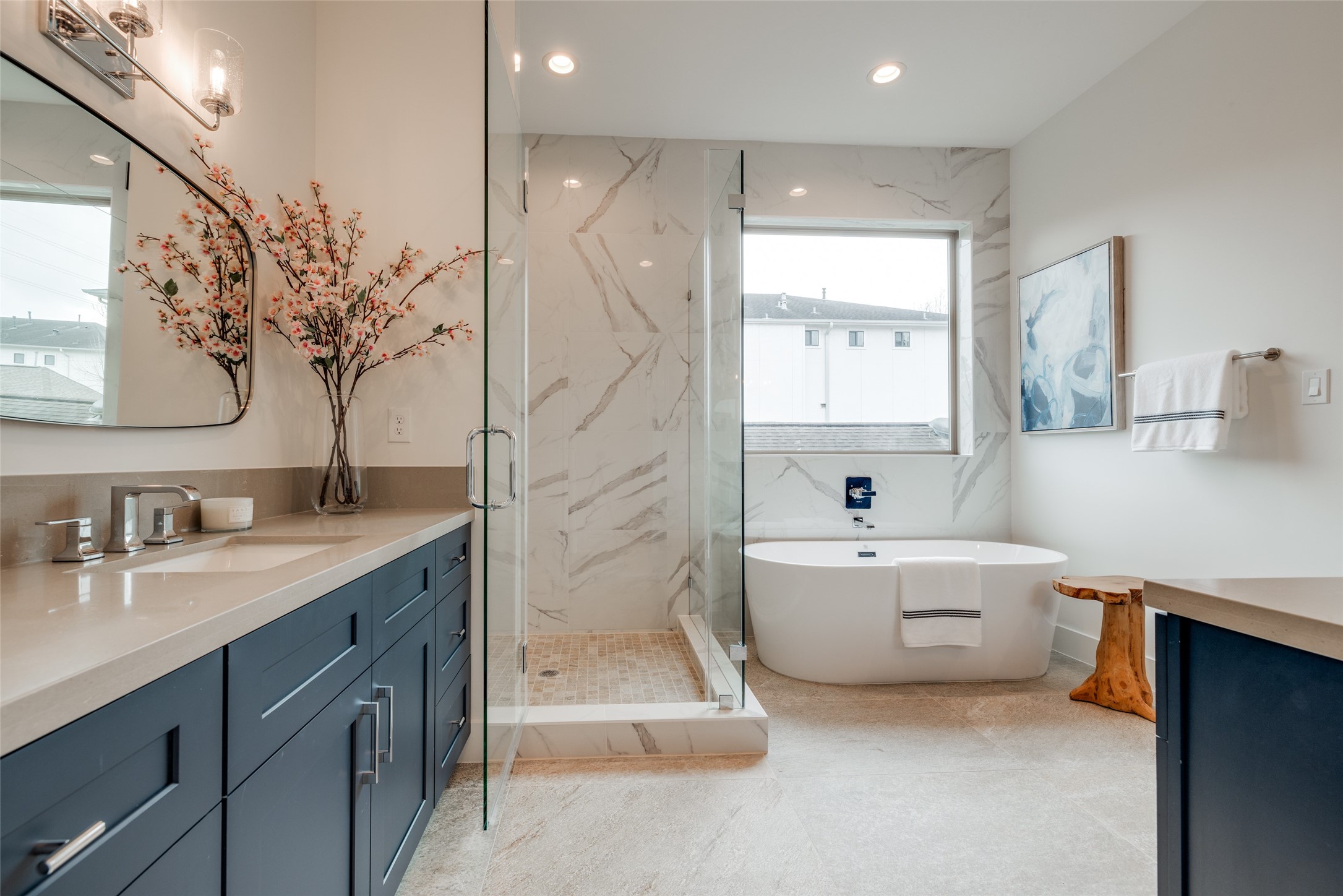 2327 Richton Street Houston, TX 77098 - Photo 34 of 47 a bathroom with a tub a sink and mirror