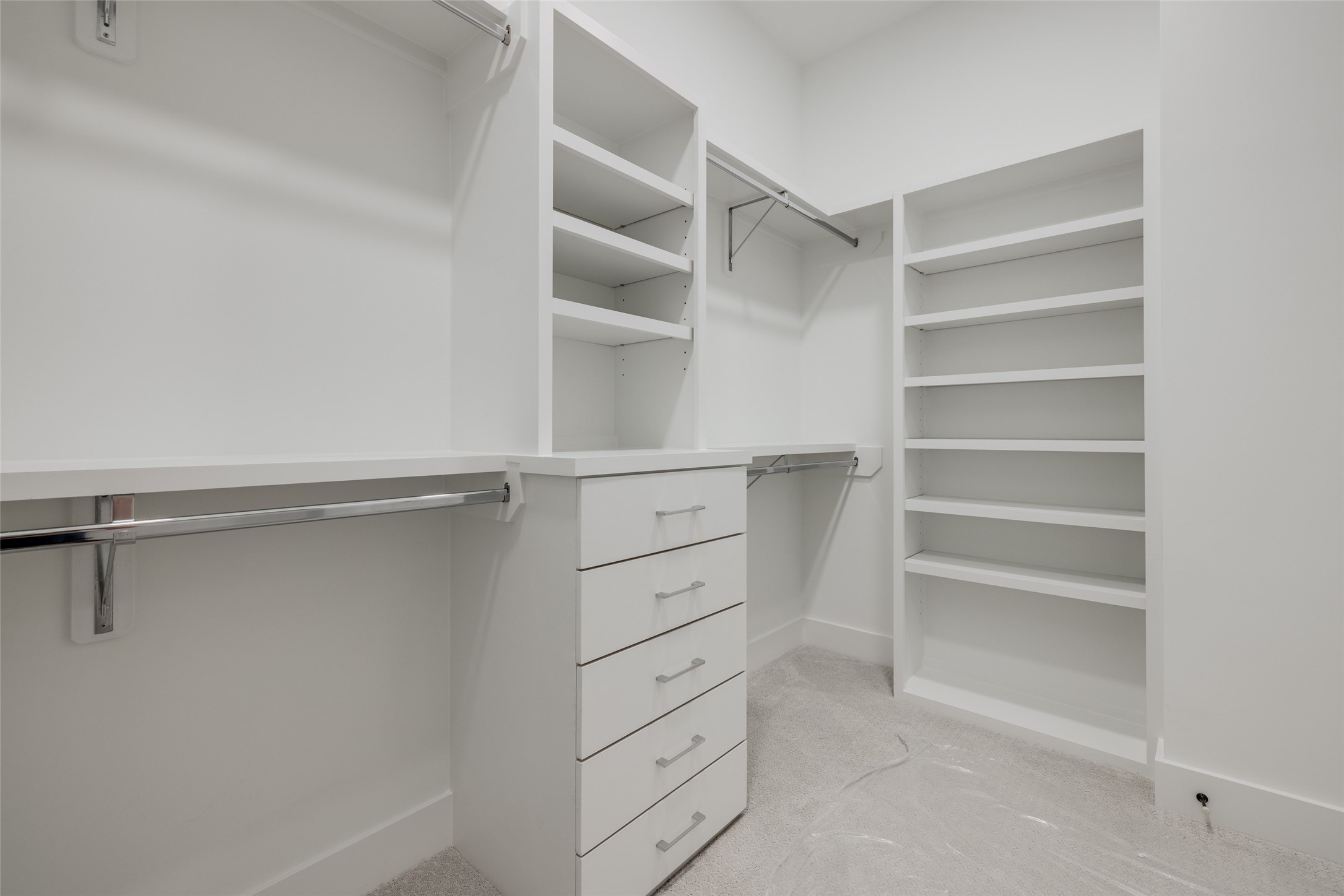 2327 Richton Street Houston, TX 77098 - Photo 37 of 47 a view of walk in closet with empty racks