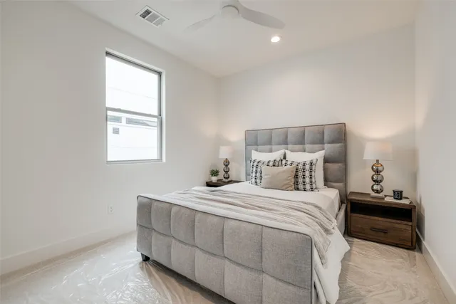 a bed room with a bed and a chandelier