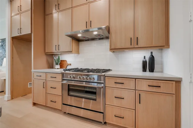 a view of a livingroom with an empty space and a fireplace