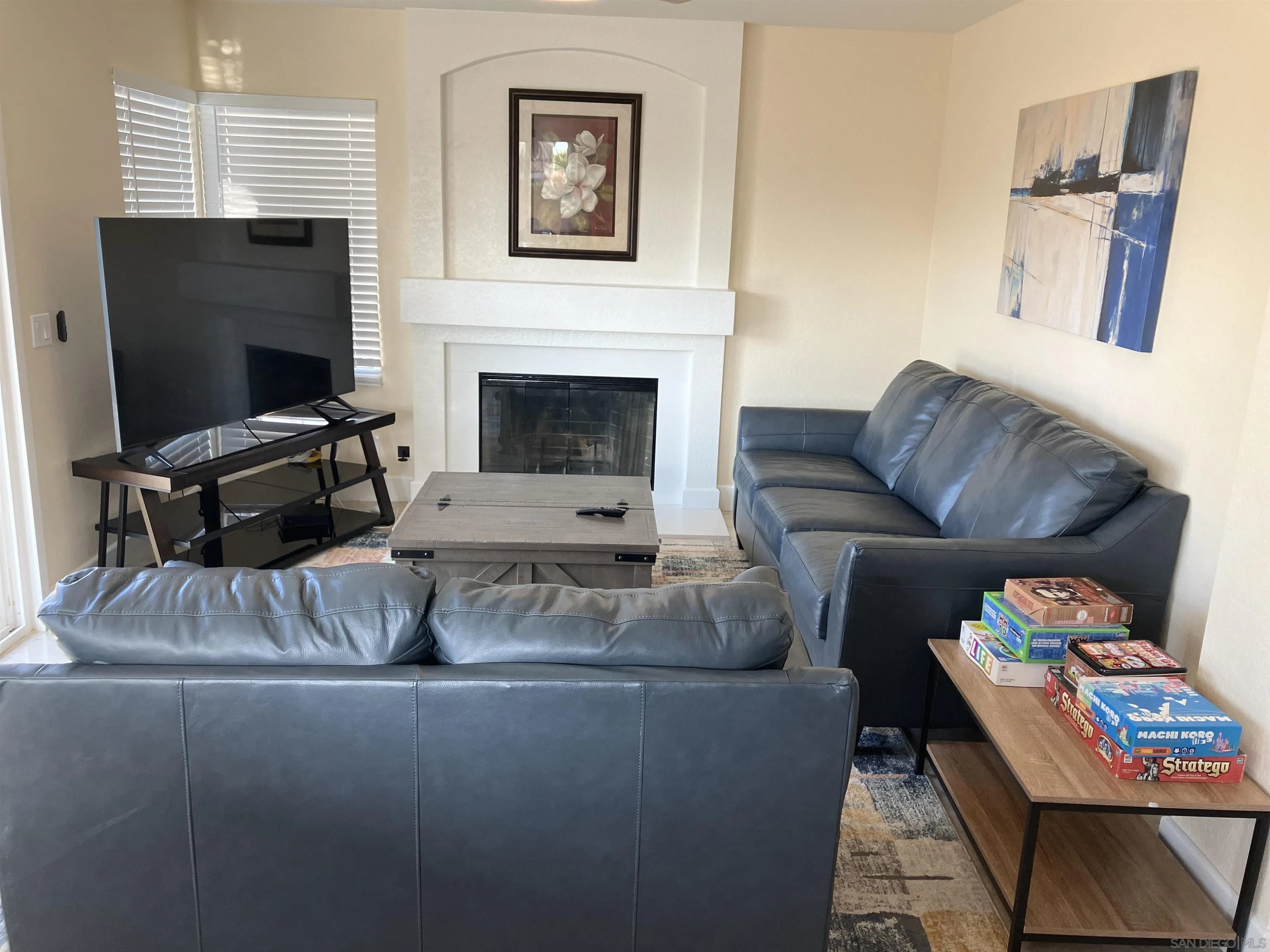 8418 Hovenweep Court San Diego, CA 92129 - Photo 12 of 29 a living room with furniture and a flat screen tv
