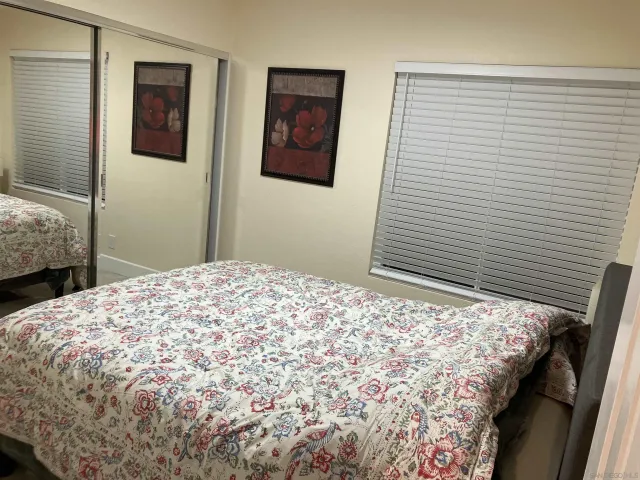 a bedroom that has a bed and a window