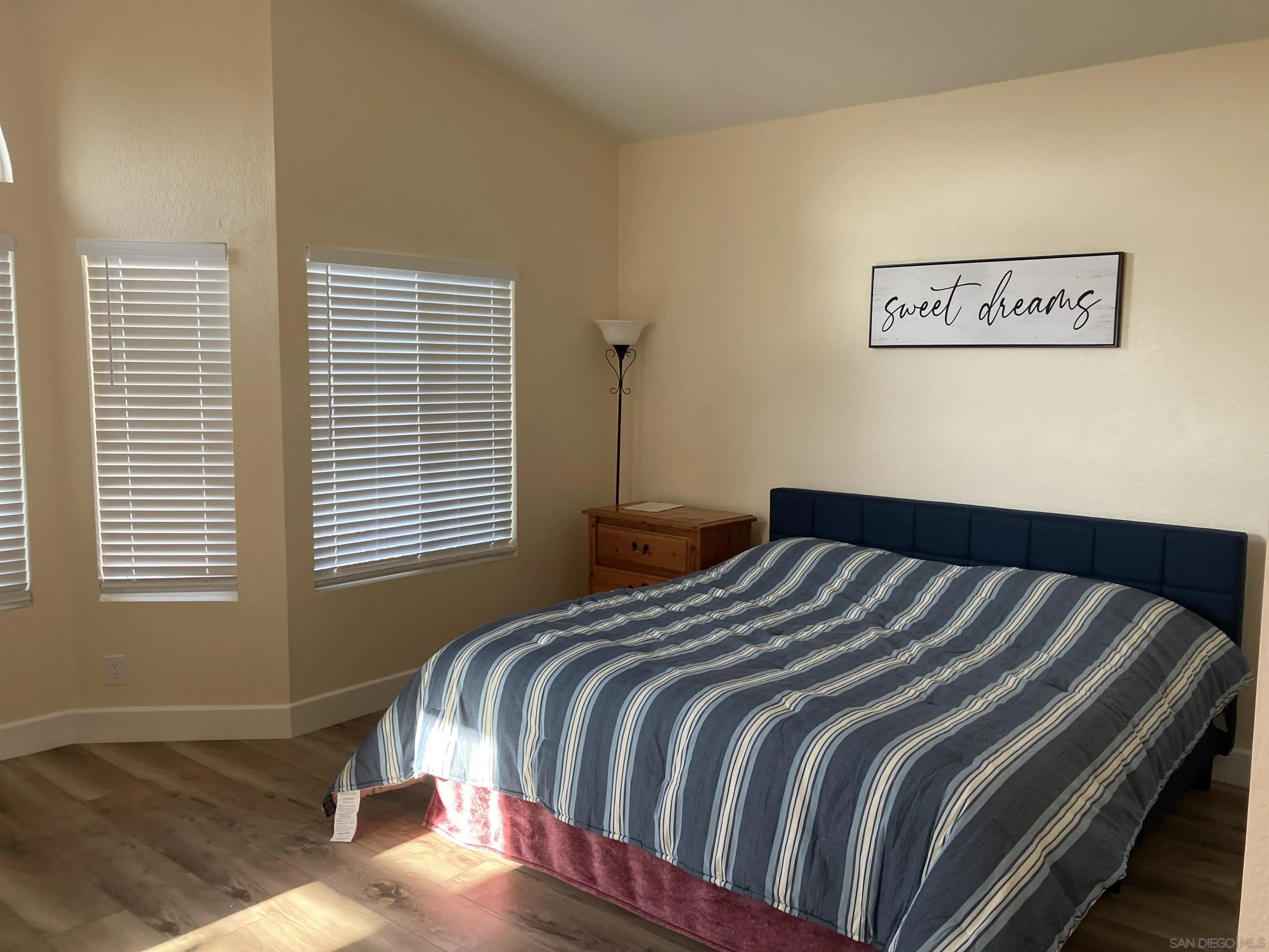 8418 Hovenweep Court San Diego, CA 92129 - Photo 18 of 29 a bedroom with a bed and a window