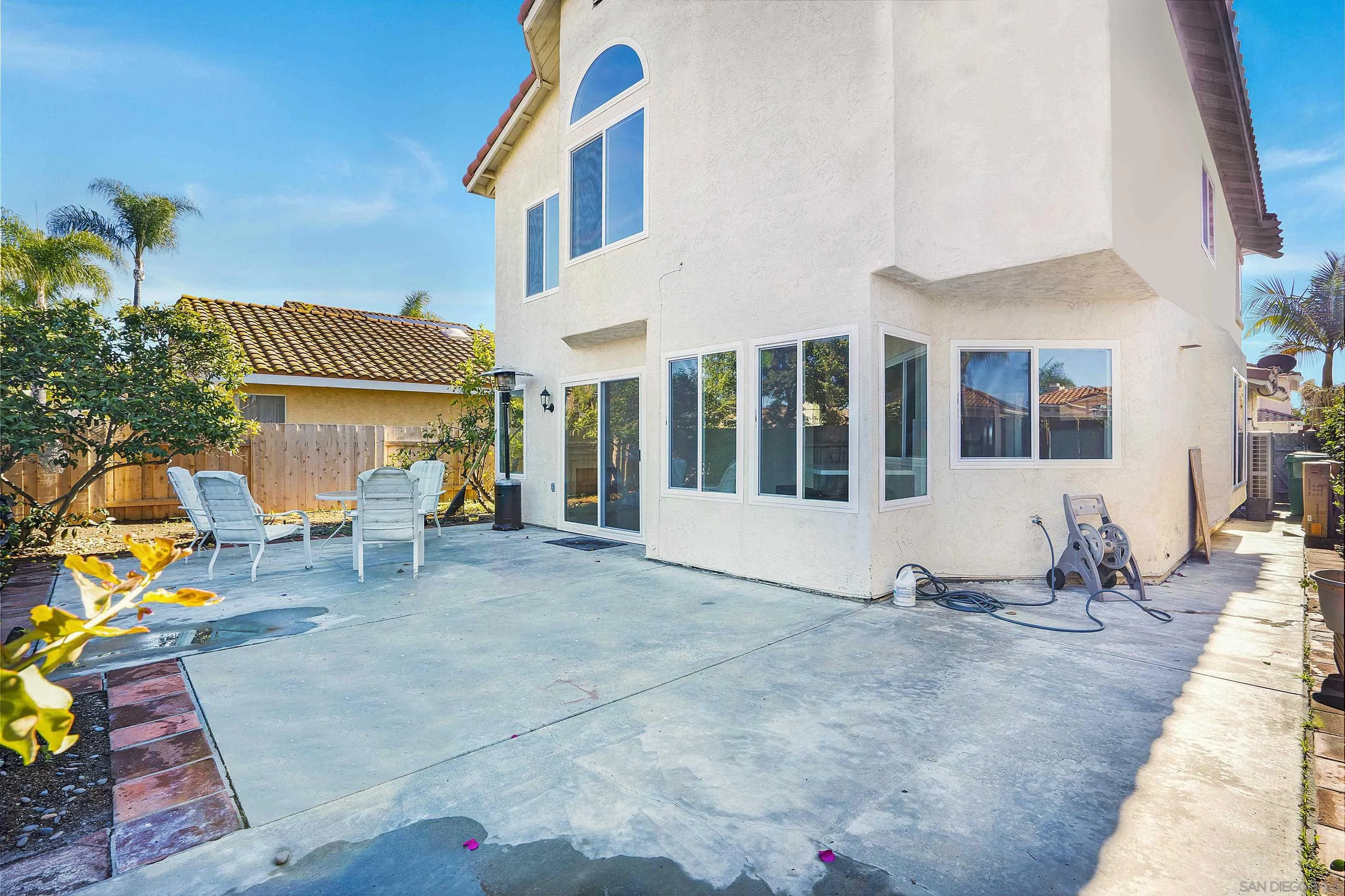 8418 Hovenweep Court San Diego, CA 92129 - Photo 24 of 29 a view of a patio with table and chairs and potted plants