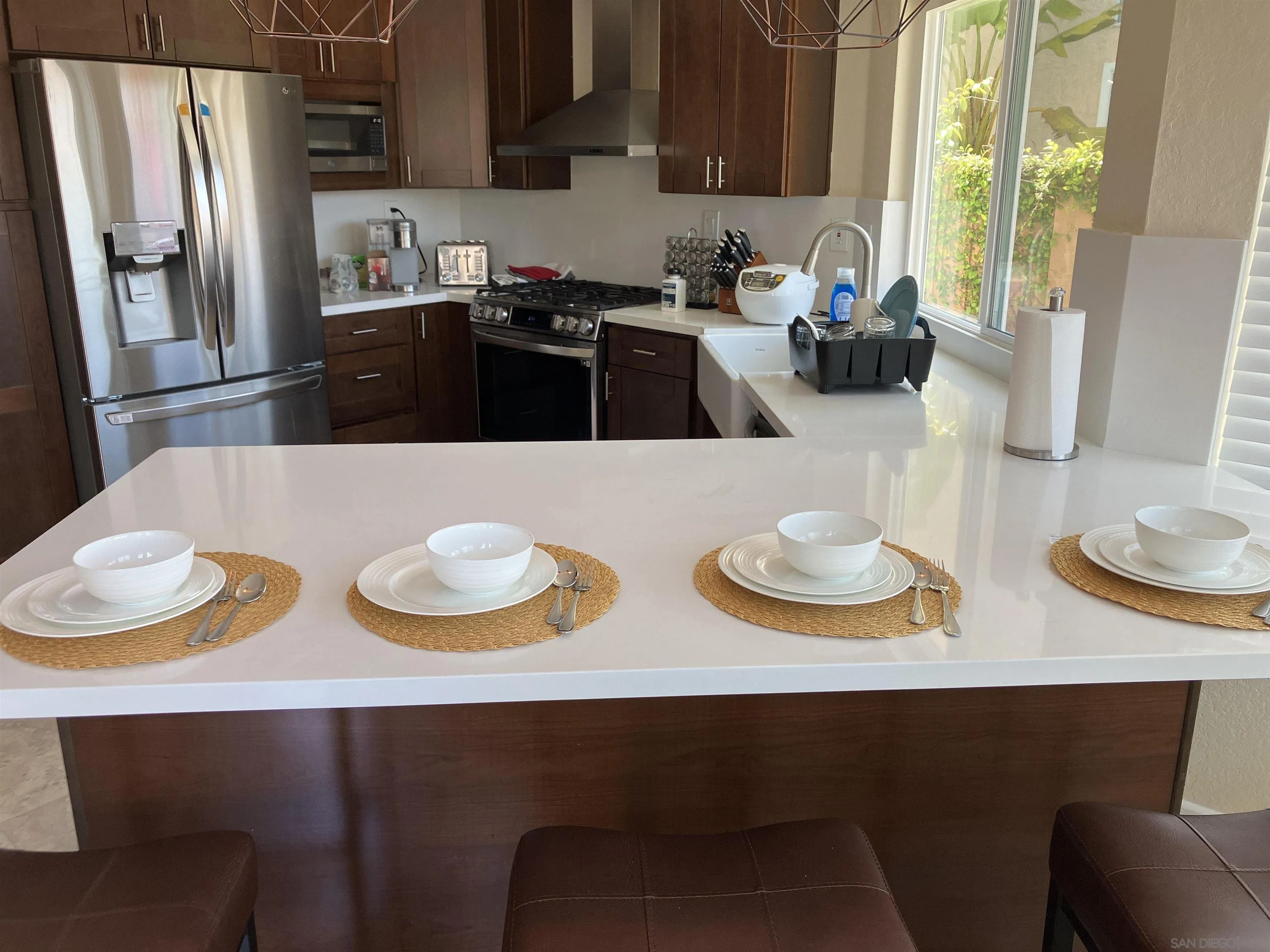 8418 Hovenweep Court San Diego, CA 92129 - Photo 4 of 29 a kitchen with a table and chairs in it
