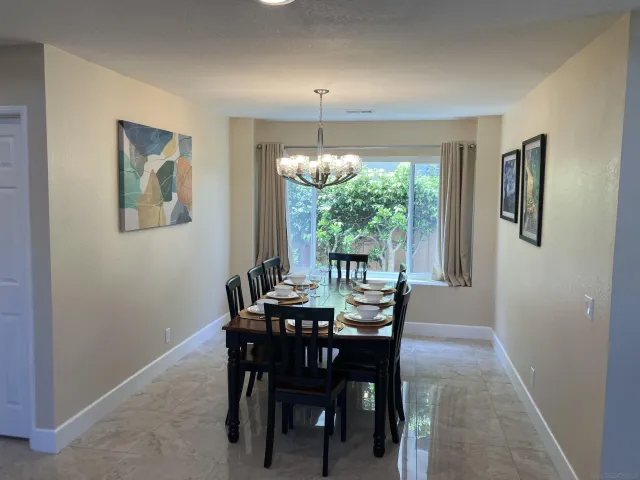 a view of a dining room with furniture window and outside view