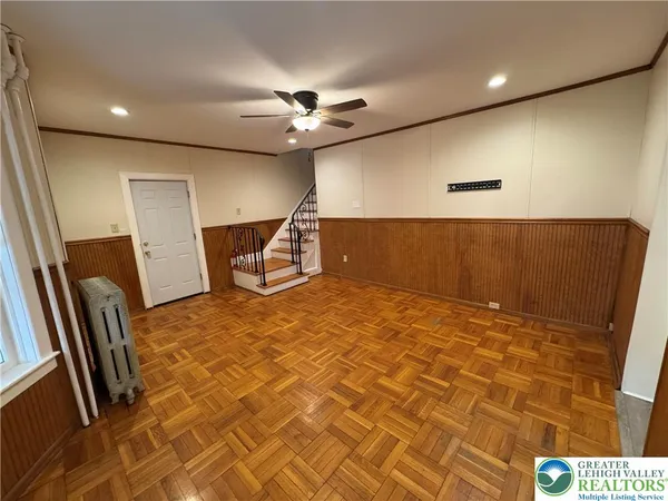 a view of an empty room with a window