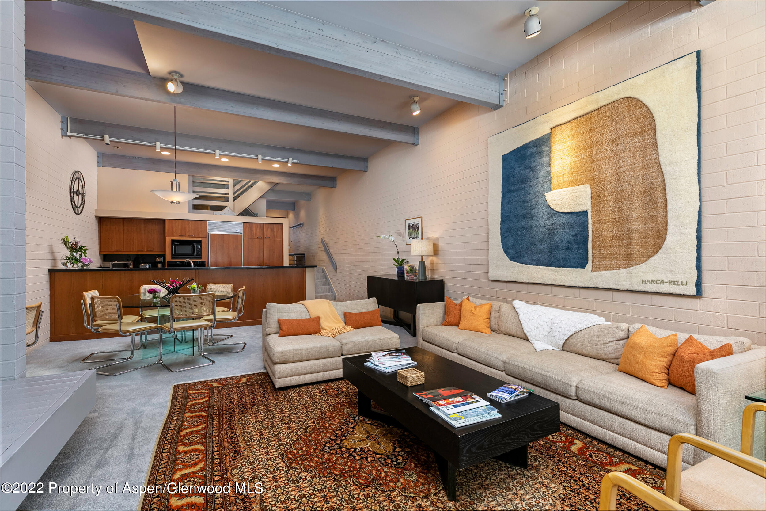 625 South W End Street, Unit 15 Aspen, CO 81611 - Photo 2 of 14 a living room with furniture and a potted plant