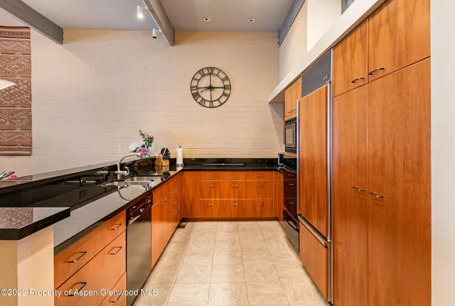 a view of a refrigerator in a kitchen