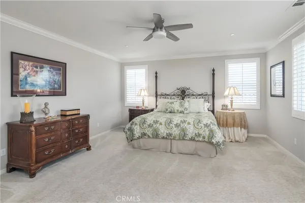 a bedroom with double bed and window
