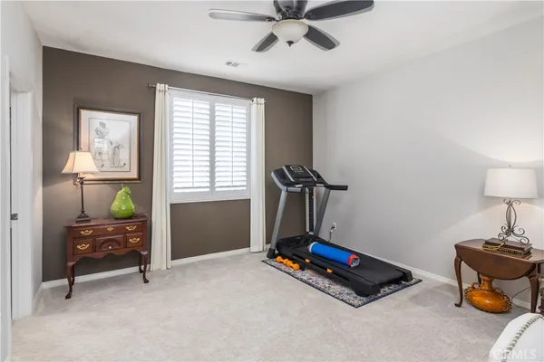 a room with gym equipment and a window