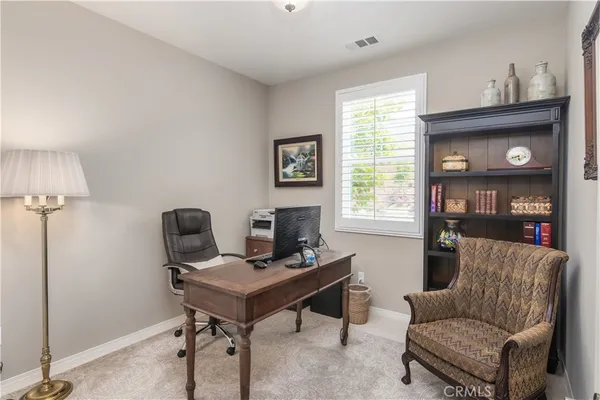 a work room with furniture and a window