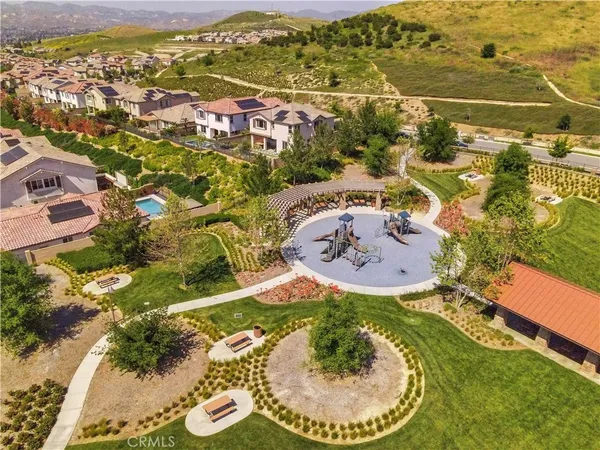 an aerial view of a residential houses with outdoor space