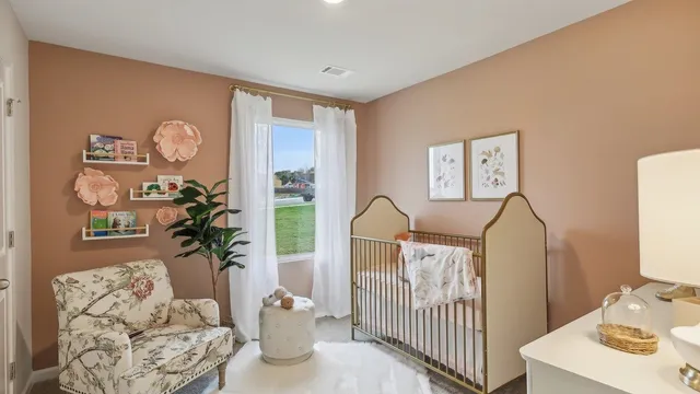 a bedroom with furniture and a window