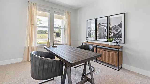 a dining room with furniture and window
