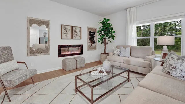 a living room with furniture and a large window