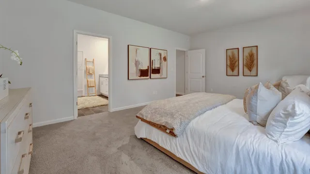 a bedroom with a bed and wall painting