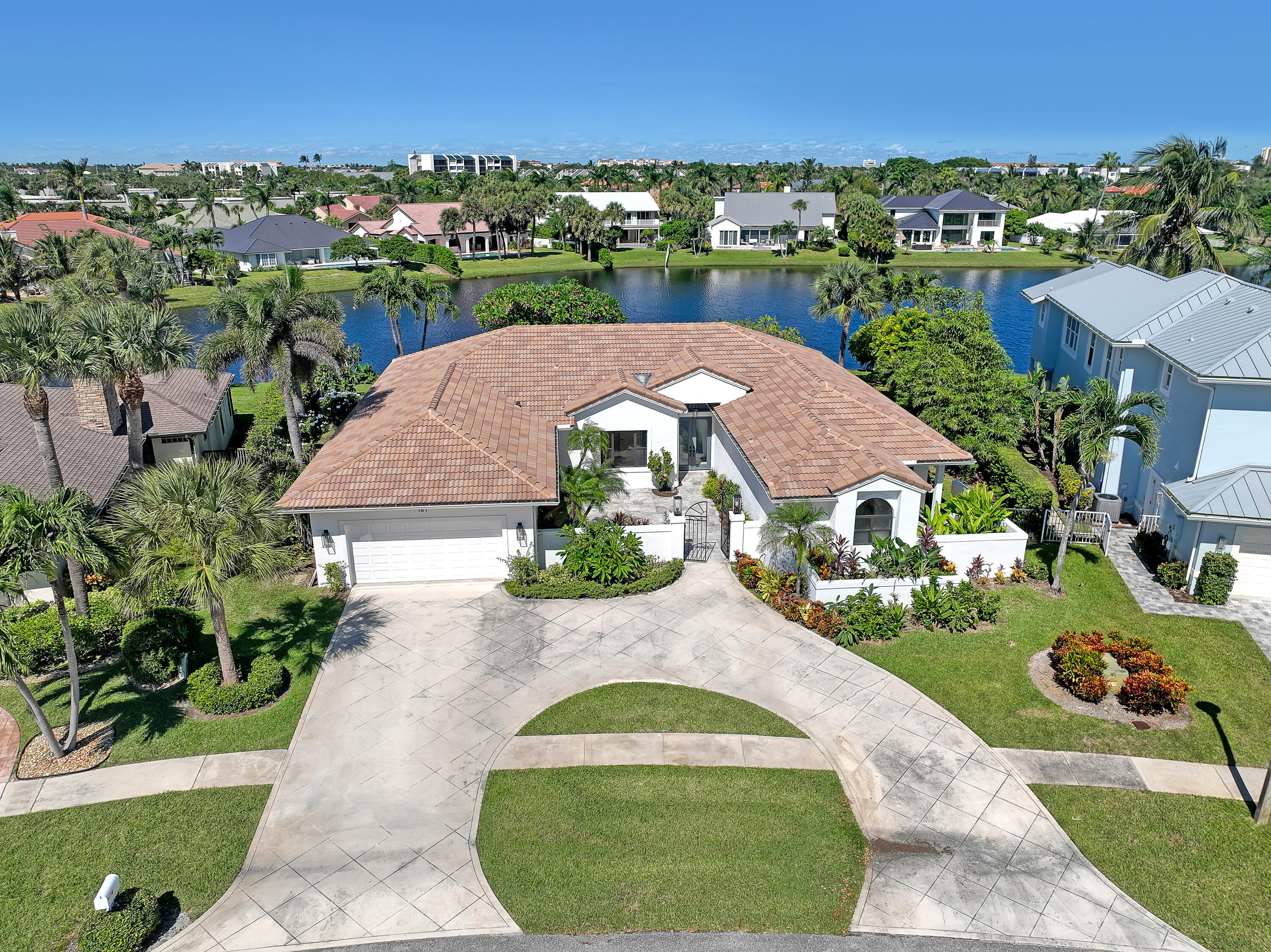161 Apollo Circle Jupiter, FL 33477 - Photo 11 of 60 an aerial view of a house with a garden and trees