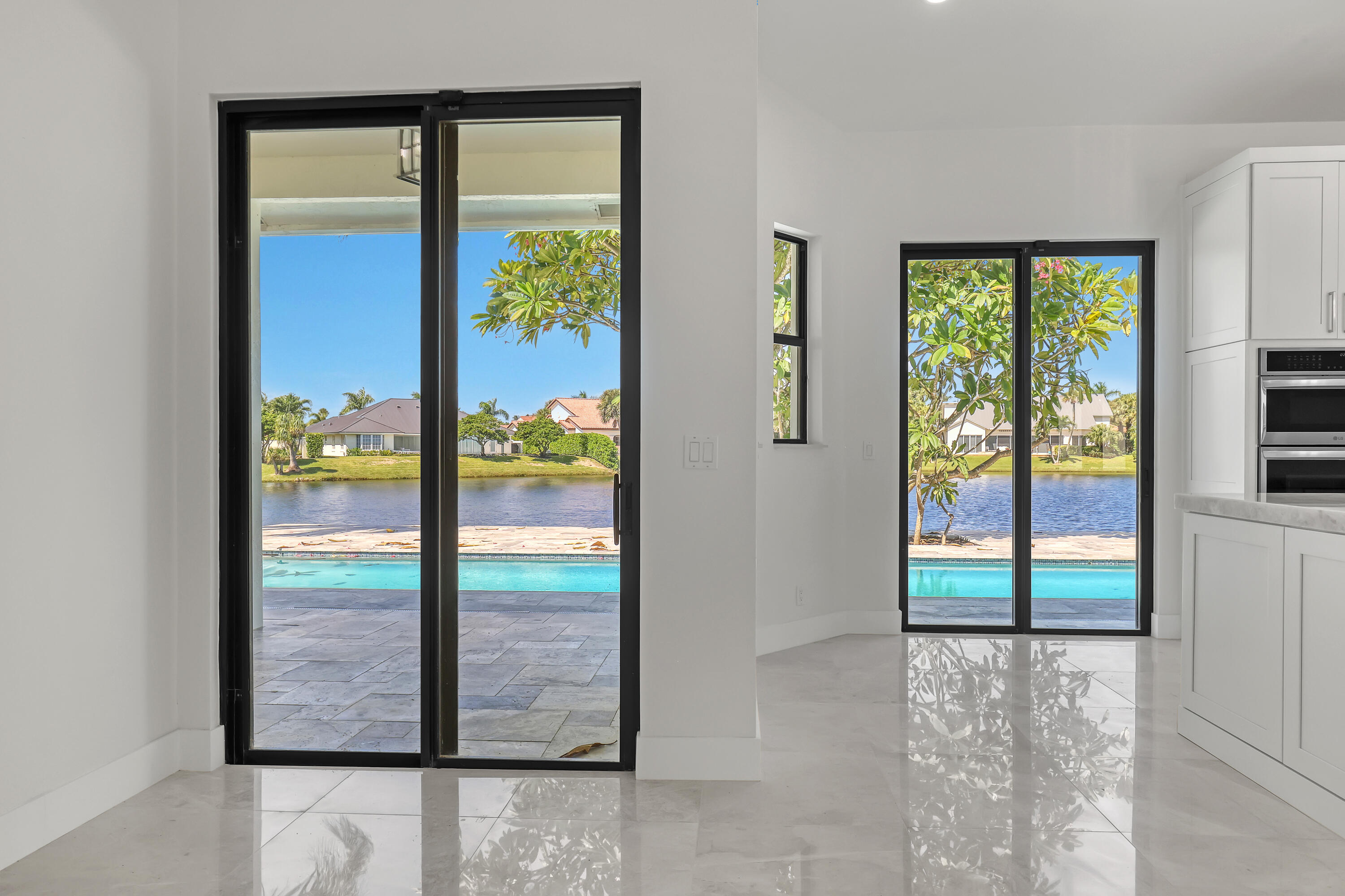 161 Apollo Circle Jupiter, FL 33477 - Photo 19 of 60 a view of a glass door with a window