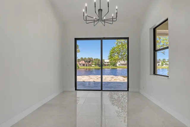 a view of an house with backyard space and balcony