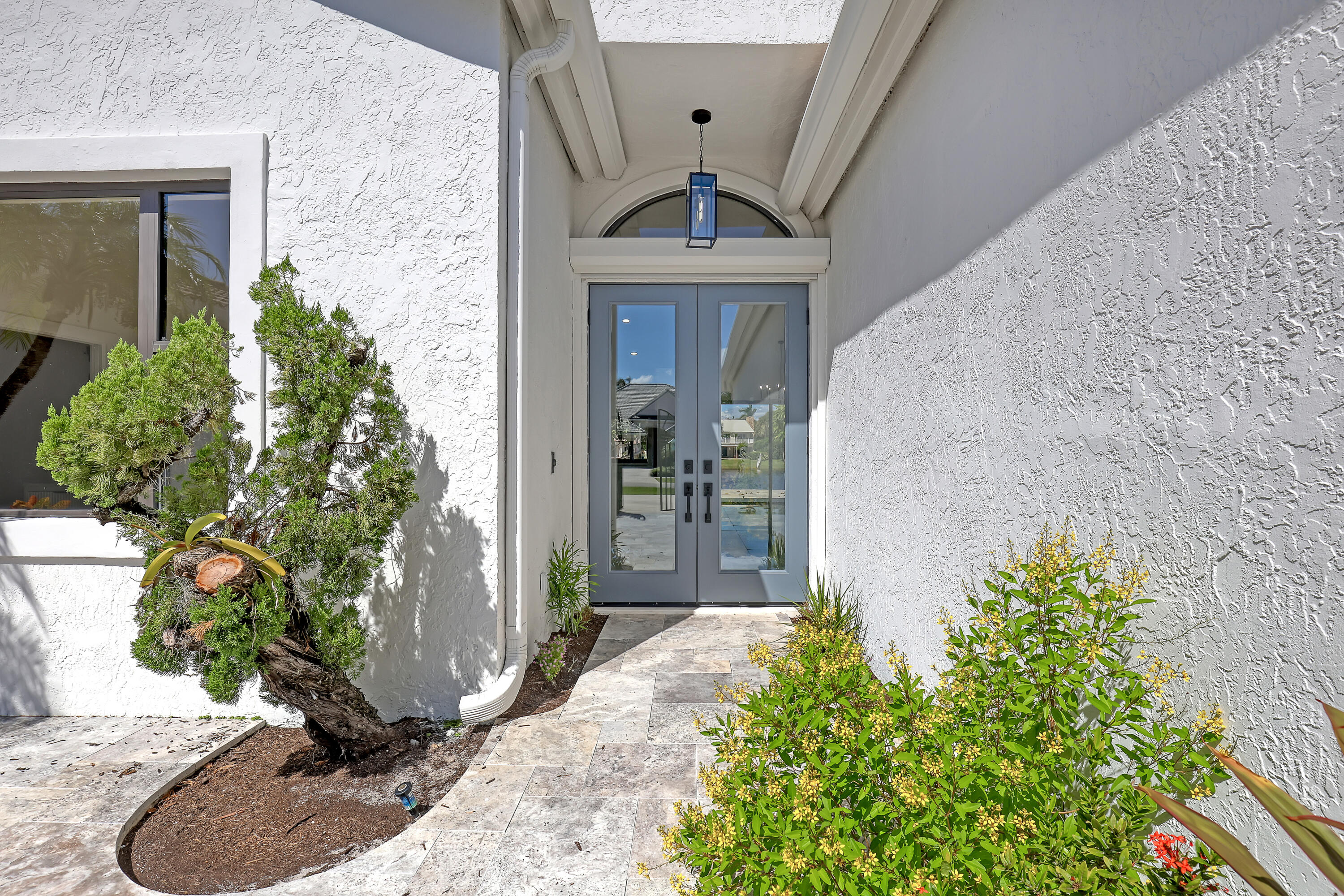 161 Apollo Circle Jupiter, FL 33477 - Photo 35 of 60 a front view of a house with garden