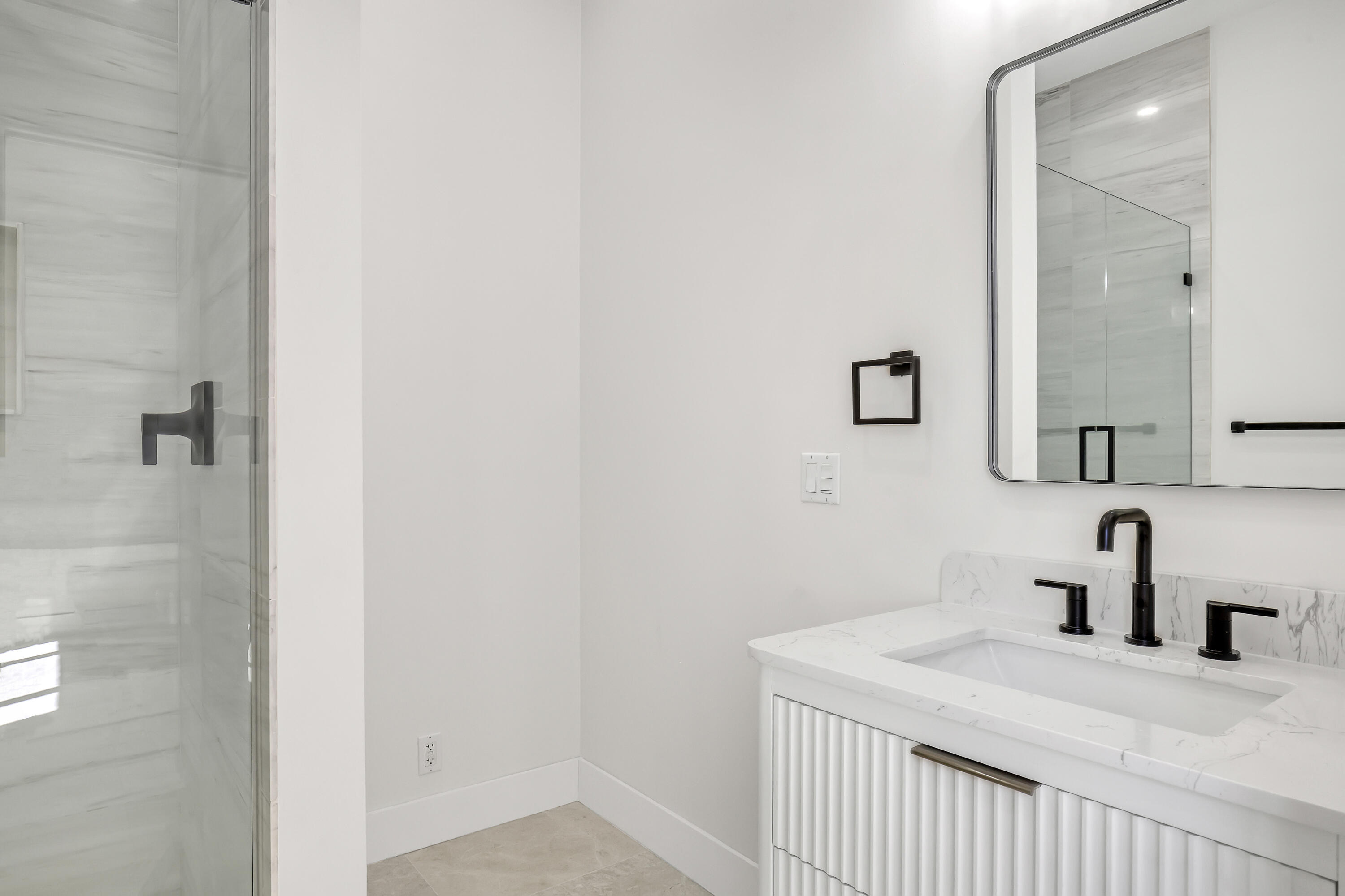 161 Apollo Circle Jupiter, FL 33477 - Photo 40 of 60 a bathroom with a sink and a mirror