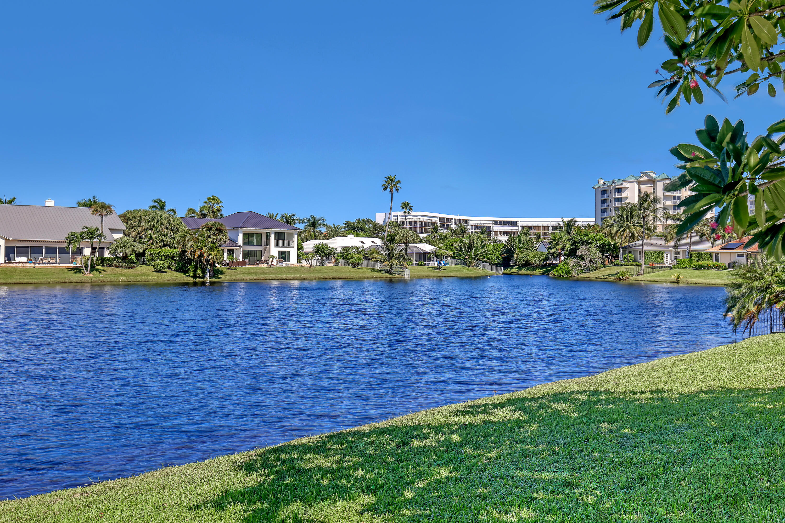 161 Apollo Circle Jupiter, FL 33477 - Photo 4 of 60 a view of a lake with houses in the back