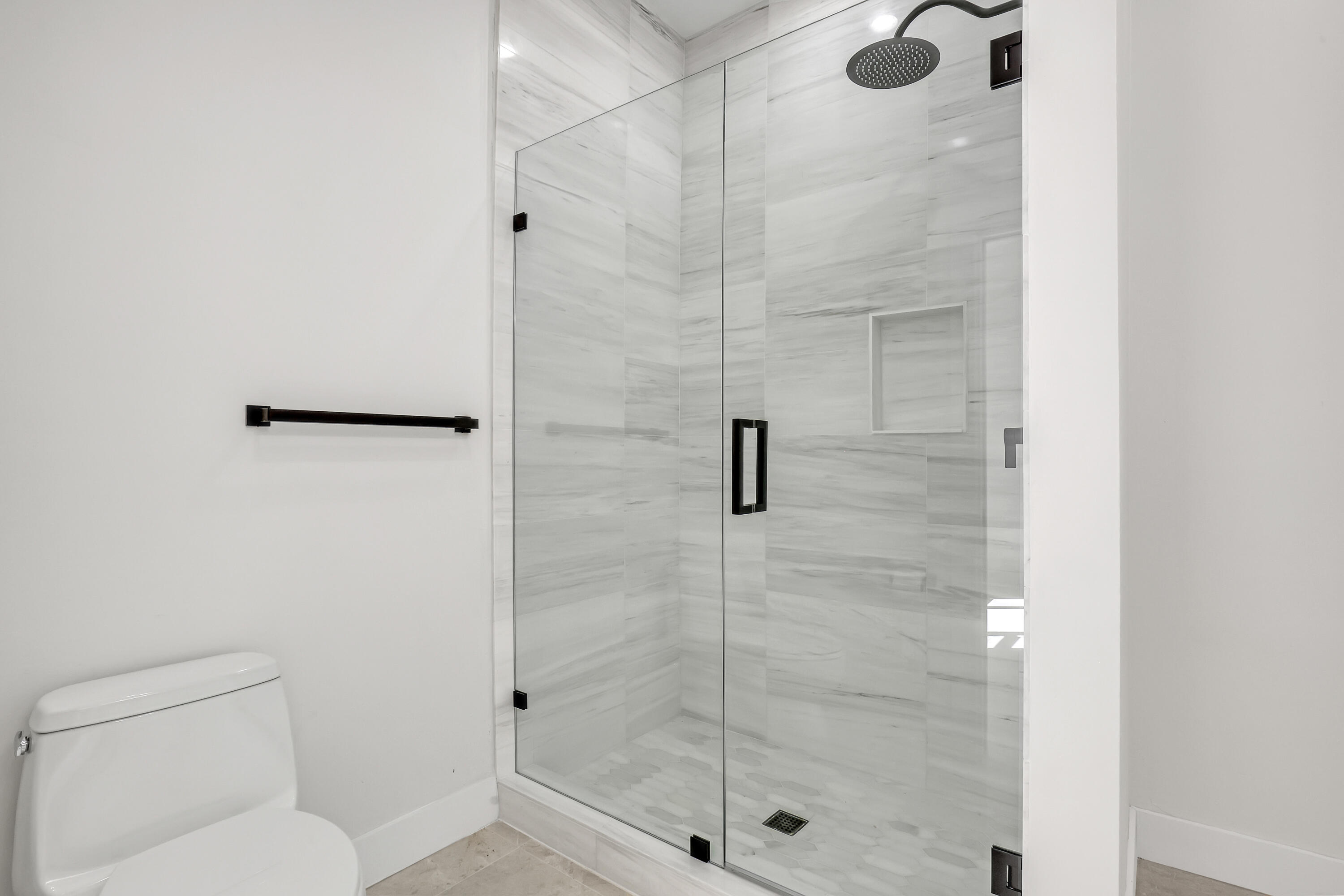 161 Apollo Circle Jupiter, FL 33477 - Photo 41 of 60 a bathroom with a shower and toilet