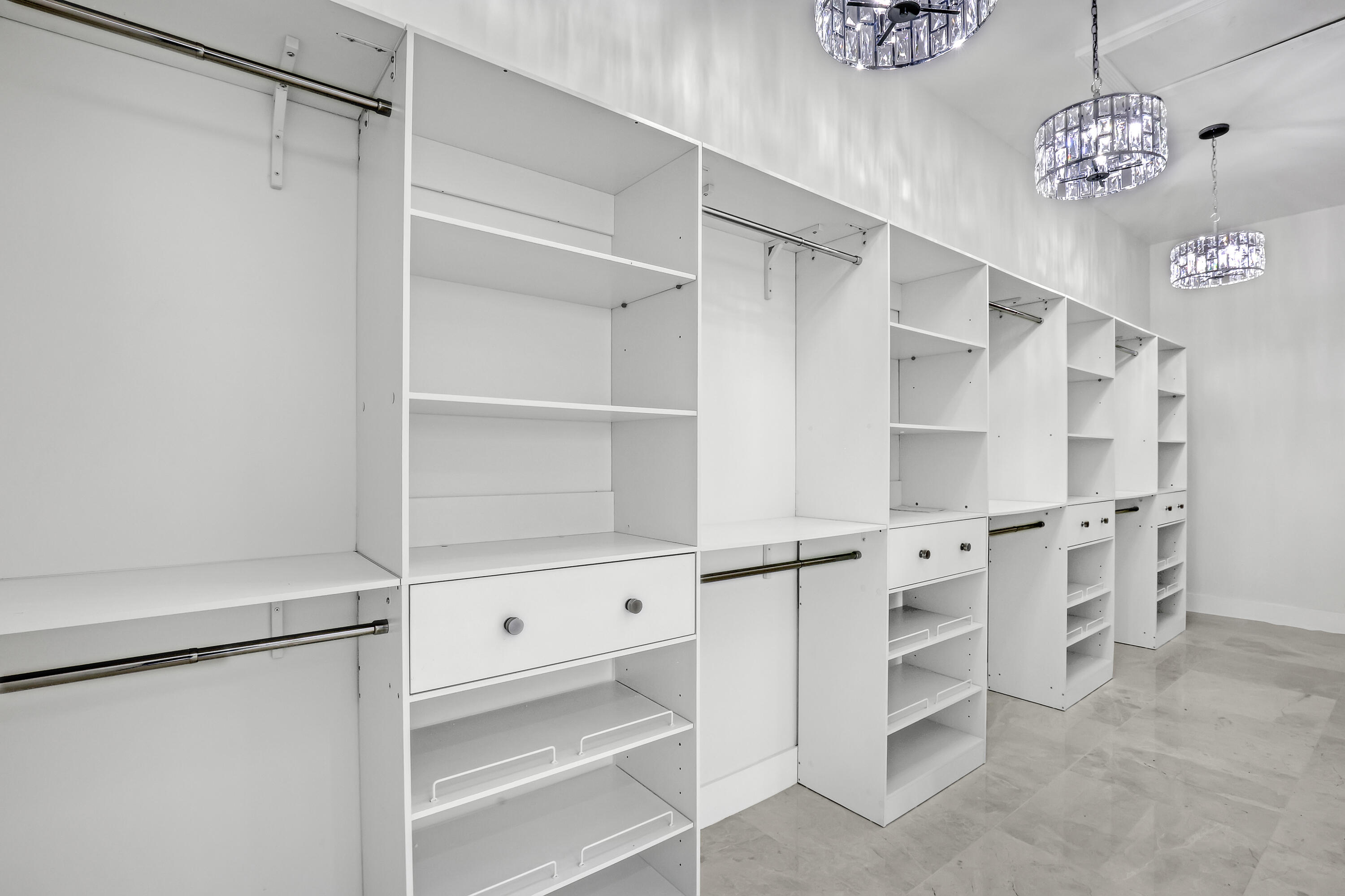 161 Apollo Circle Jupiter, FL 33477 - Photo 49 of 60 a view of walk in closet with empty racks