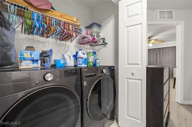 a utility room with dryer and washer