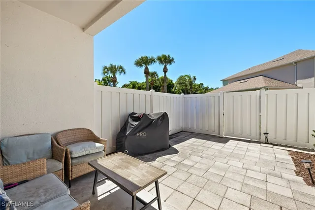 a view of balcony with furniture